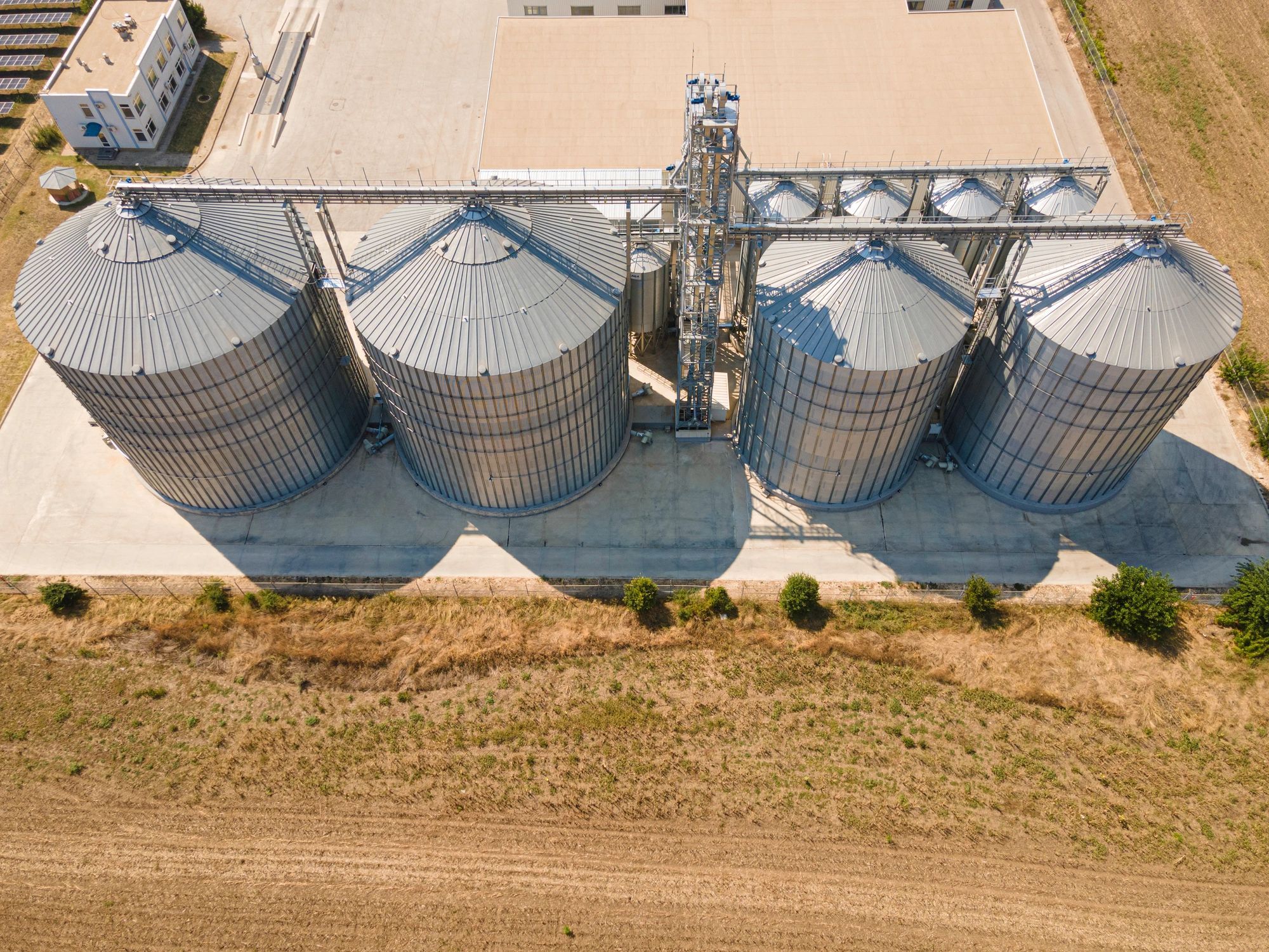 Agricultural storage silos supporting grain handling and supply